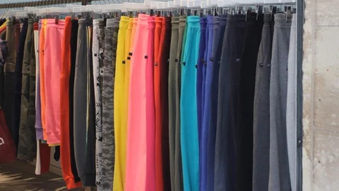 Paris, Multicolored Pants Hanging On Rack Shop Street. Street Market Clothes. Stock Footage 88298602