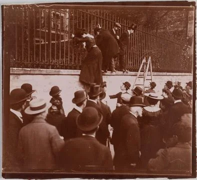 Paris Museums, Characters Amount to a grid in front of a crowd, Paris. Stock Photos