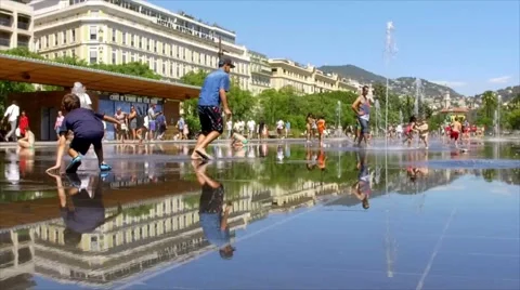 Paris. NICE Place Massena. children play in the fountain in the Stock Footage