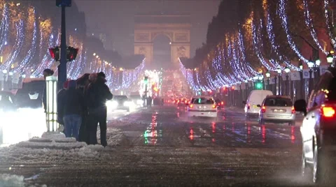 Paris by night at champs-élysées-elysees covered in snow Stock Footage 979969