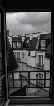 Paris open window view rooftop gables Stock Photos