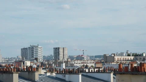 Paris rooftops with terracotta chimney pots overlook urban residential housing Stock Footage 337295657