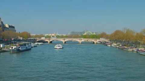 Paris Seine river bridge view boat sailing cityscape handheld wide Stock Footage 340550185