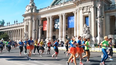 PARIS - SEPTEMBER 7, 2017: Big crowd are running the marathon in the city road Stock Footage 105165850