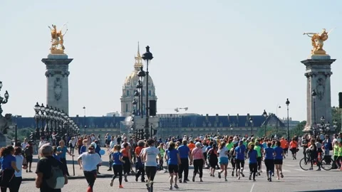 PARIS - SEPTEMBER 7, 2017: Big crowd are running the marathon in the city road Stock Footage 105212042