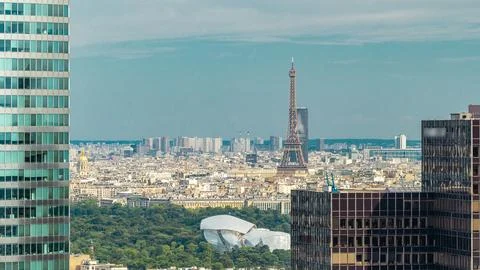 Paris skyline overview and Eiffel Tower timelapse from the top of the skyscra Stock Photos