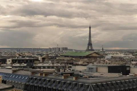 Paris skyline with rooftops and the Eiffel tower on a cloudy day. Paris symbol 库存照片