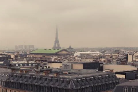 Paris skyline with rooftops and the Eiffel tower on a foggy day. Paris symbol 库存照片
