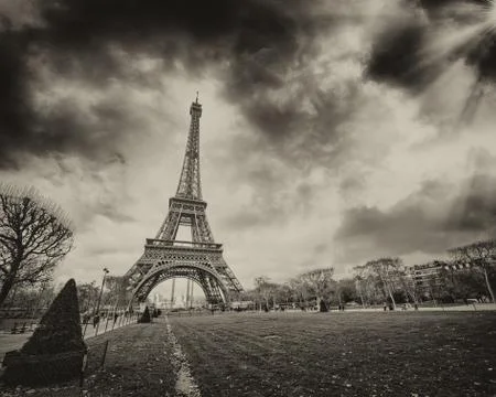 Paris. stunning sunset over eiffel tower. champs de mars with beautiful sky c Stock Photos