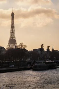 Paris at sunset with the Eiffel Tower and the bridge Alexander III Stock Photos