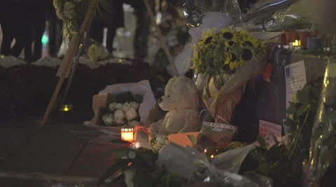 Paris terror attacks - Shrine and teddy bear Stock Footage 57339026