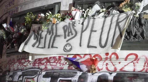 Paris terror attacks - Shrine and banner Stock Footage 57339400