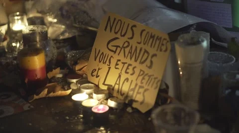Paris terror attacks - Shrine, candles and message Stock Footage 57339356