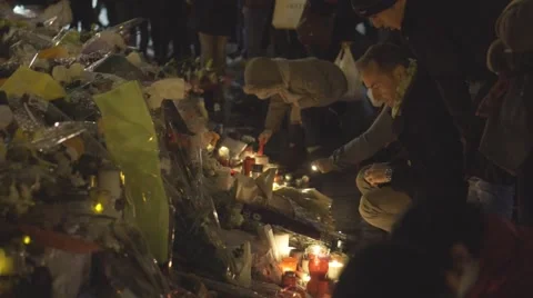 Paris terror attacks - Shrine at night, place de la République Stock Footage 57339695
