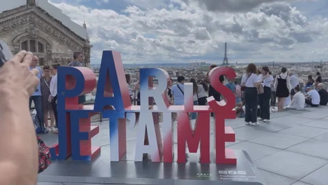 Paris, three-dimensional letters that tourists take pictures with on a roof, Stock Footage 313919503