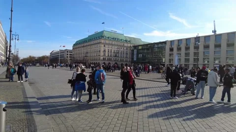 Pariser Platz Brandenburg Gate long shot pan tourists day blue sky 4K Stock Footage 173099569