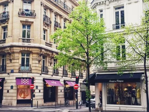 Parisian architecture and historical buildings, restaurants and boutique stores Stock Photos