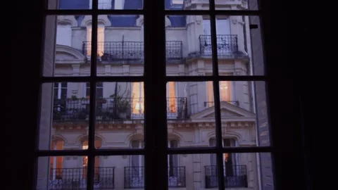 Parisian building seen through window at dusk Stock Footage 307602467