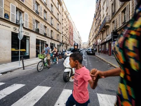 Parisian intersection with pedestrians drivers Stock Photos