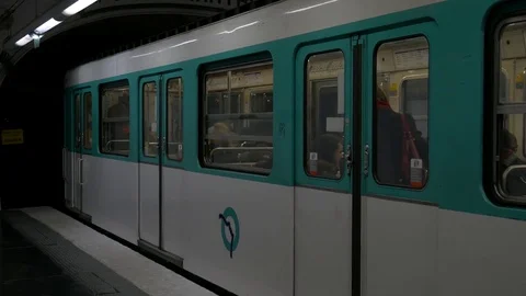 Parisian metro leaving the train station Stock Footage