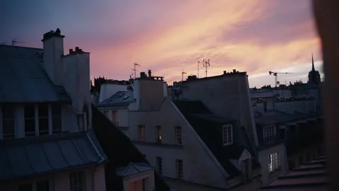 Parisian rooftops view during a dramatic colorful sunset Stock Footage 346990260