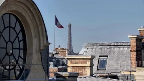 Parisian round window rooftop With Eiffel Tower and tricolore French Flag Stock Footage 163692037