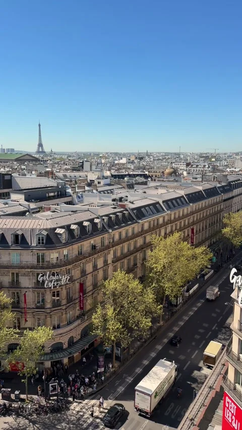 Parisian skyline view over Boulevard Haussmann with Eiffel Tower Stock Footage 337782937
