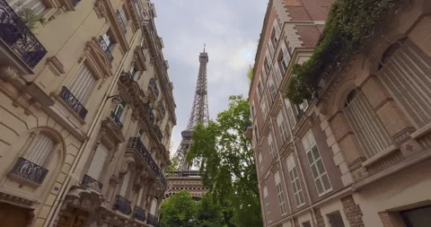 Parisian street view of the Eiffel Tower. Parisian architecture in the center of Stock Footage 245941023