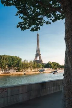 Parisian Sunset: Eiffel Tower View from the Seine Stock Photos