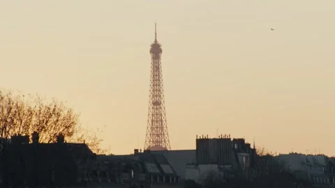 Parisian sunset illuminating eiffel tower: a serene urban vista Stock Footage 306461722