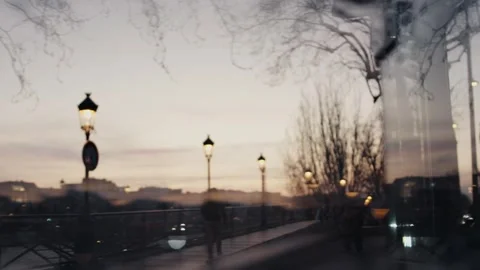 Parisian sunset reflecting on bus window during evening commute Stock Footage 312999569