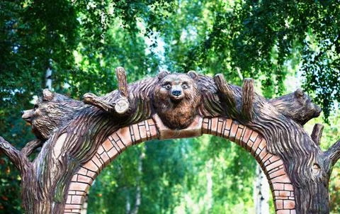 Park arc gate with bear head background Stock Photos