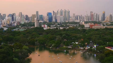 The park area is full of big trees. Near the business area in the city center Stock Footage 131967484