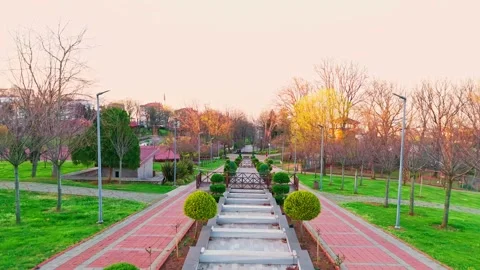 A park with a bench and a bench in the middle Stock Footage 272952640