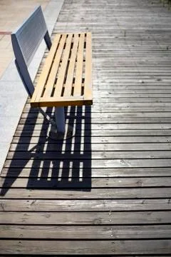 Park bench on boardwalk Stock Photos