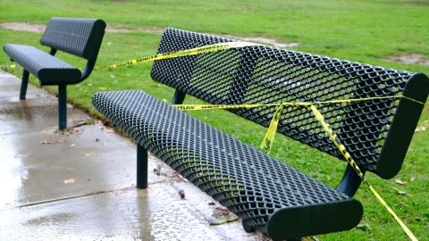 Park Bench With Caution Tape Foto stock