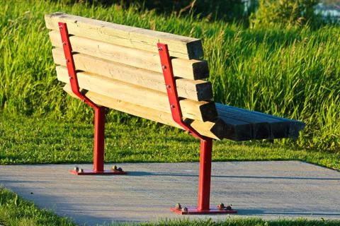 A park bench on a concrete base Stock Photos