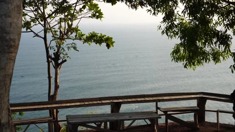 Park bench on the edge of the cliff of the ocean. Stock Footage 280372791