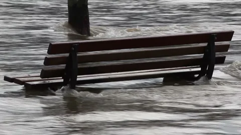 Park bench in flooded river Stock Footage 1020095