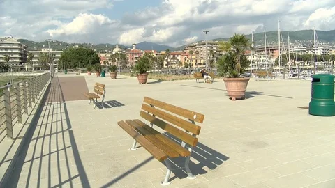 Park bench on pier walkway Stock Footage 76832170