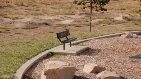 Park Bench Revealed by Left to Right Glide Stock-Footage 345102587