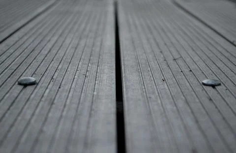 Park bench texture. Gray background. Closeup. Lines. Rivets Stock Photos
