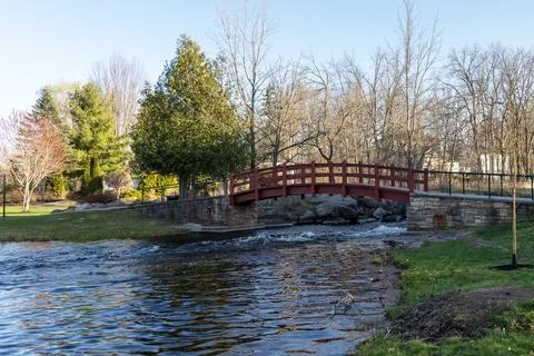 Park with bridge over stream in spring. Stewart Park In Perth, Ontario, Canad Stock Photos
