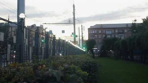 Park with a busy road in the evening Stock Footage 217641032