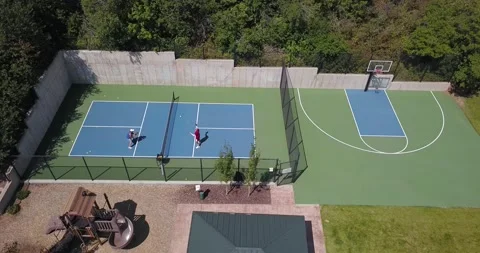 Park City, Utah - Pinebrook Pickleball Courts with Two Players Drilling Stock Footage