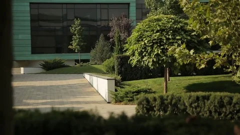 Park in front of the large modern building, m/s Stock Footage 75986813