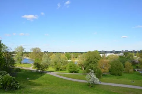 Park with gren grass and path and trees in Canada Stock Photos
