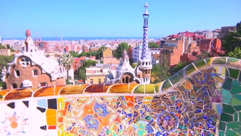 Park guell in barcelona spain features gaudi's iconic mosaic benches and gi.. Vídeo Stock 337754925