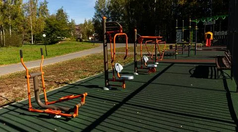 The park has various types of exercise equipment available Stock Photos