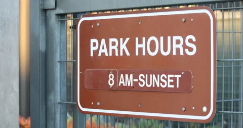 Park Hours Sign In Sunlight Stock Footage 224918813